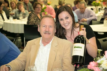 March:  Bruce Mettler shows off his winning bid at the San Joaquin Farm Bureau's annual wine auction.