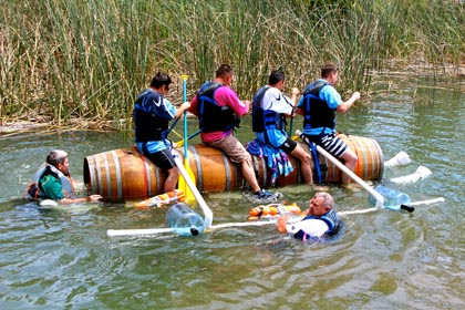 Peltier Station’s yeomanly four-barrel boat, with winemaker J.C. van Staden bringing up the rear (in the water)… 