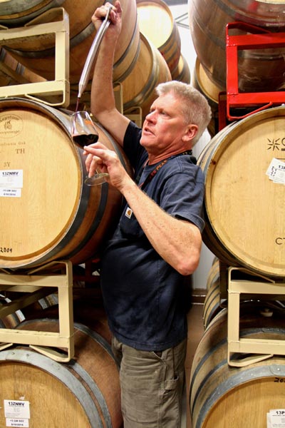 m2 winemaker/owner Layne Montgomery thieving sample of 2014 Zinfandel