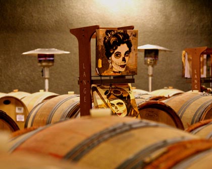 Kathy Womack’s Dia de Los Muertos inspired paintings among LangeTwins barrels…