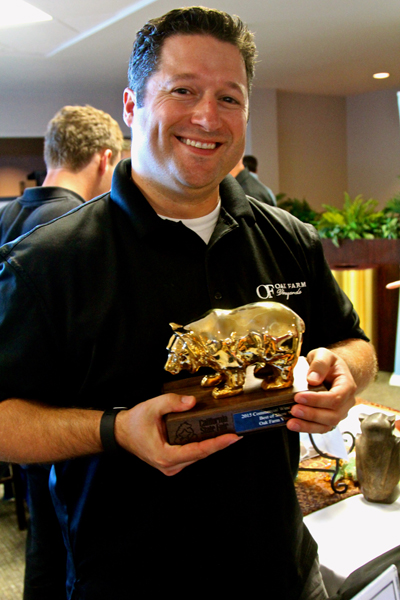 Oak Farm Managing Partner Dan Panella shows off Golden Bear trophy