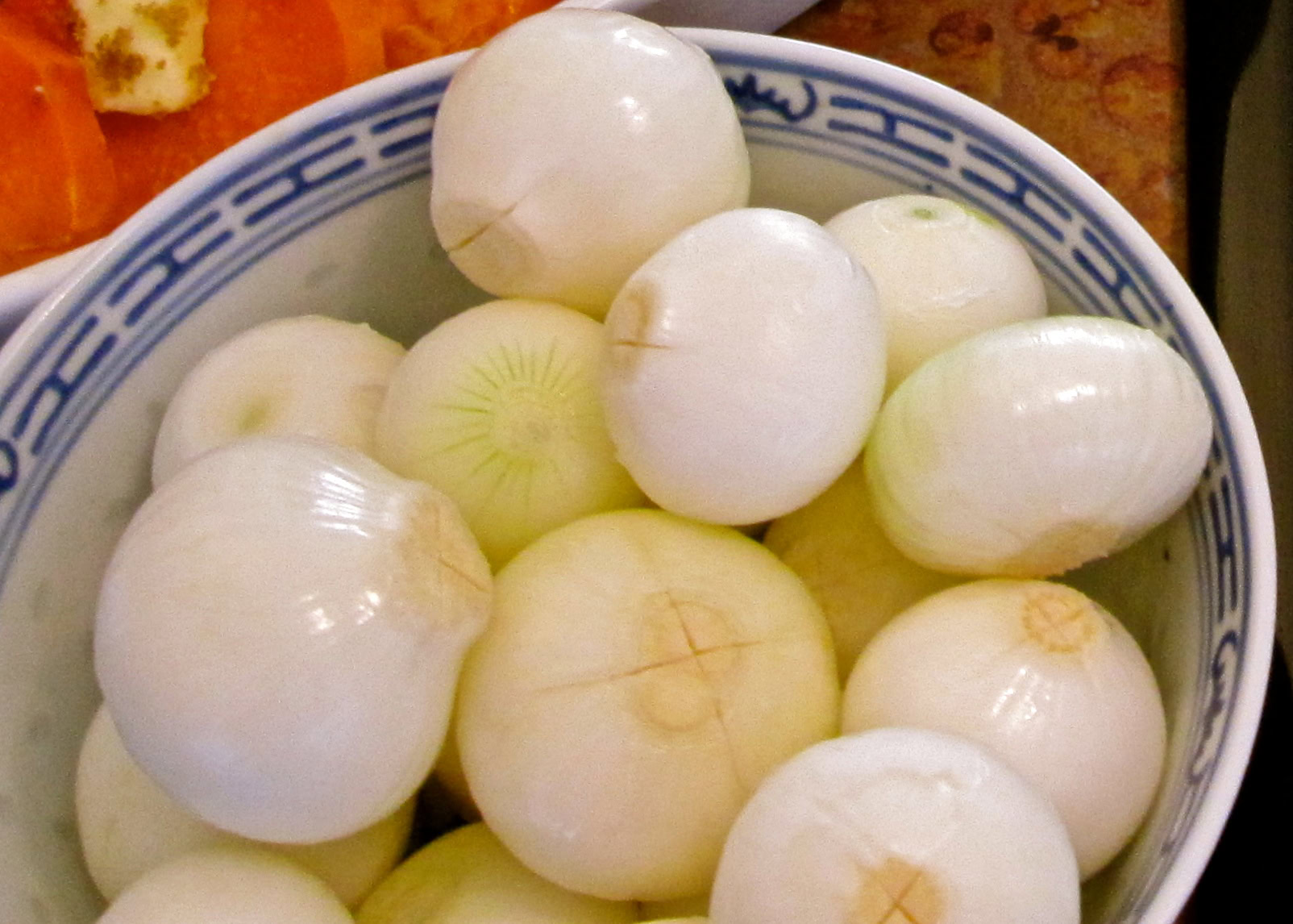 Fresh onions in a bowl, used in Lodi wine and food pairings, highlighting local produce.