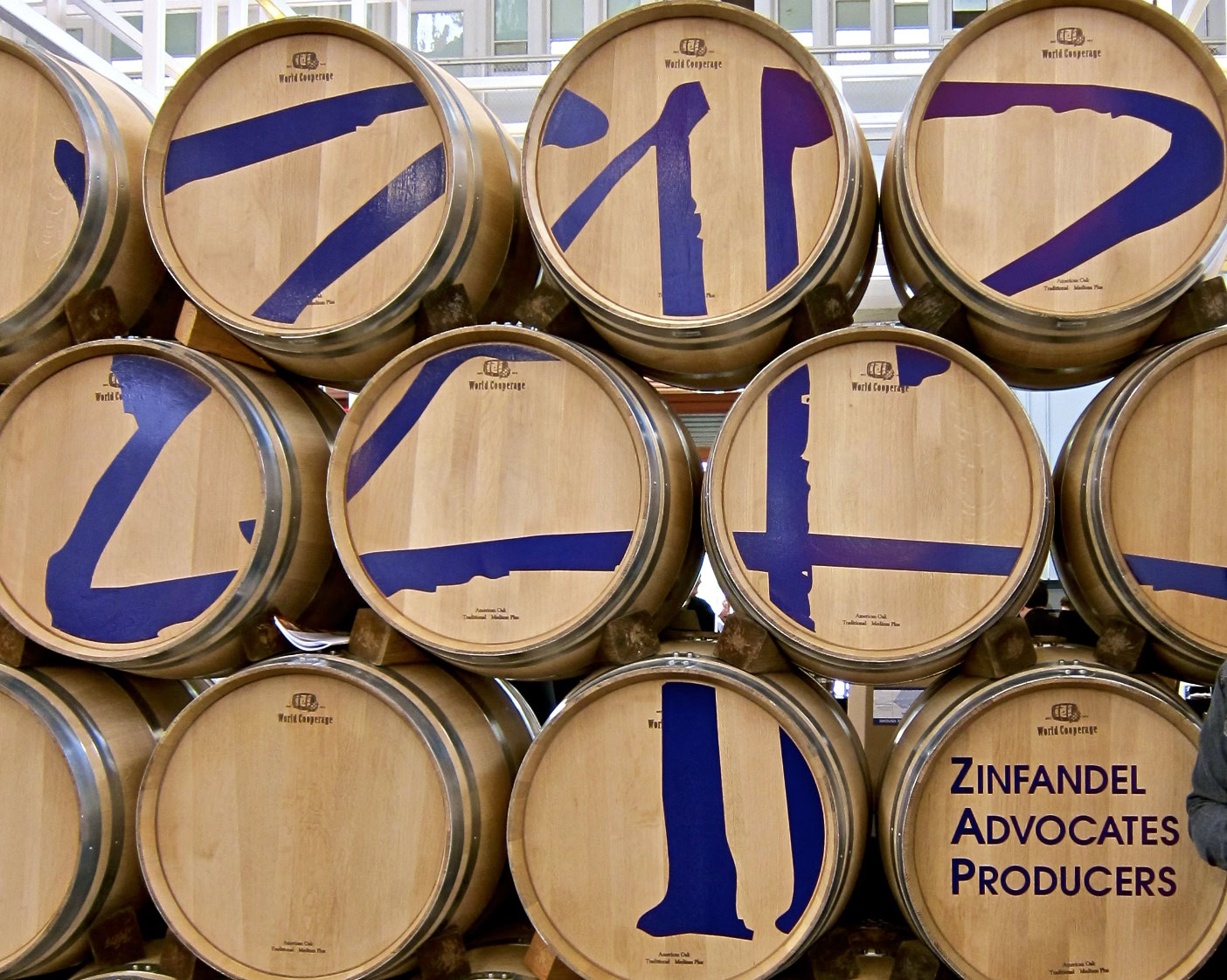 Wooden wine barrels with blue painted numbers and text for Lodi Winegrape Commission.