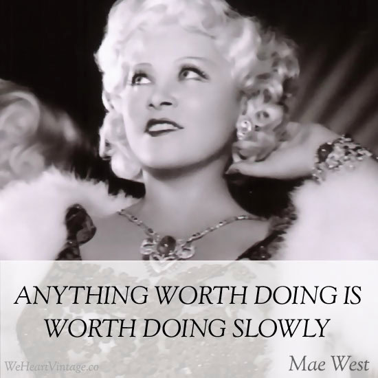 Vintage black and white photo of Mae West with quote about worth and doing things slowly.