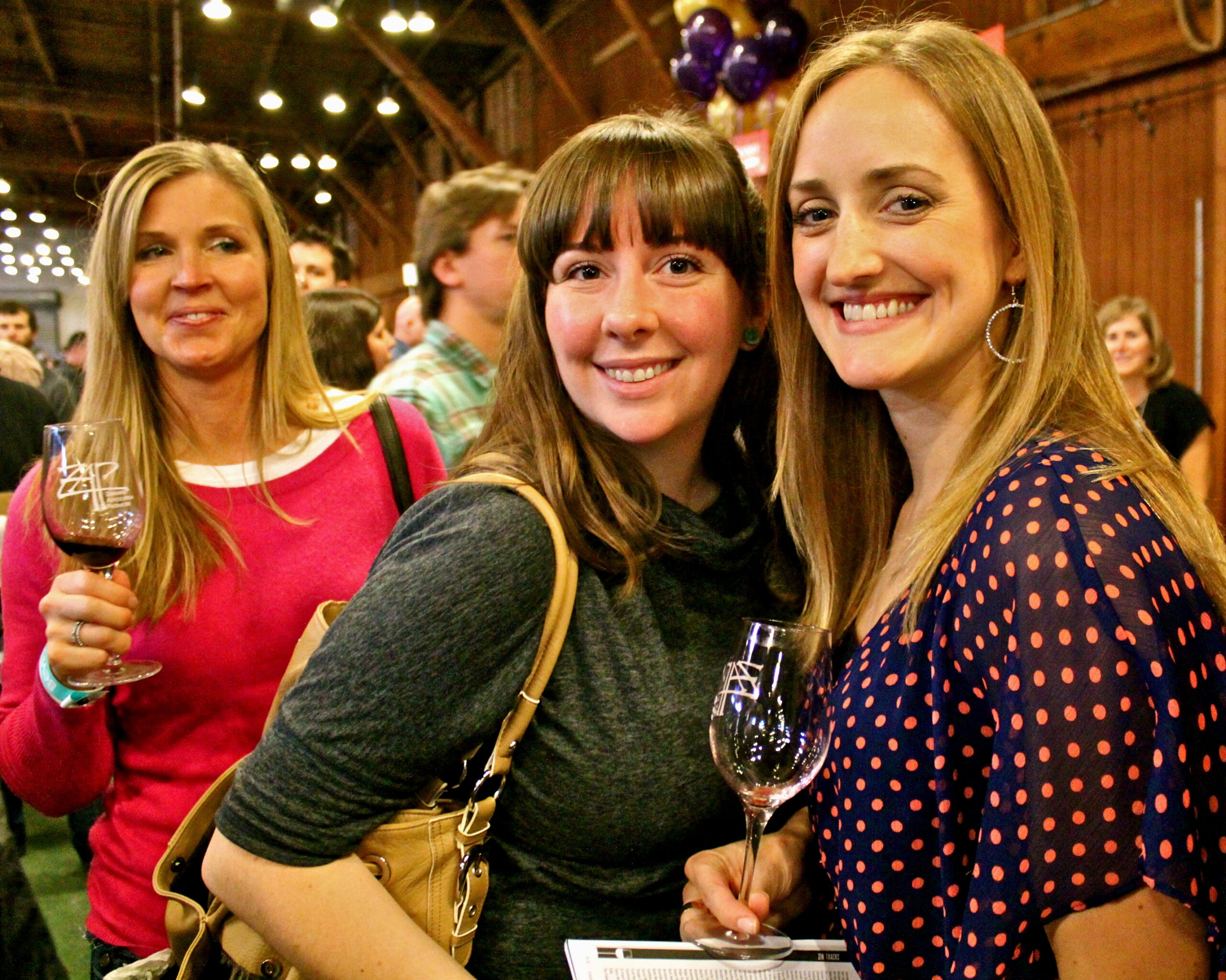 Group of women enjoying wine tasting at a Lodi Wine event, smiling and holding wine glasses.