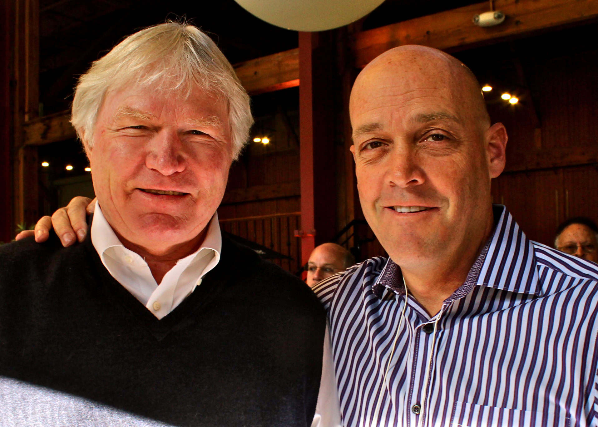 Two men at a Lodi Winegrape Commission event, smiling and posing for the camera.