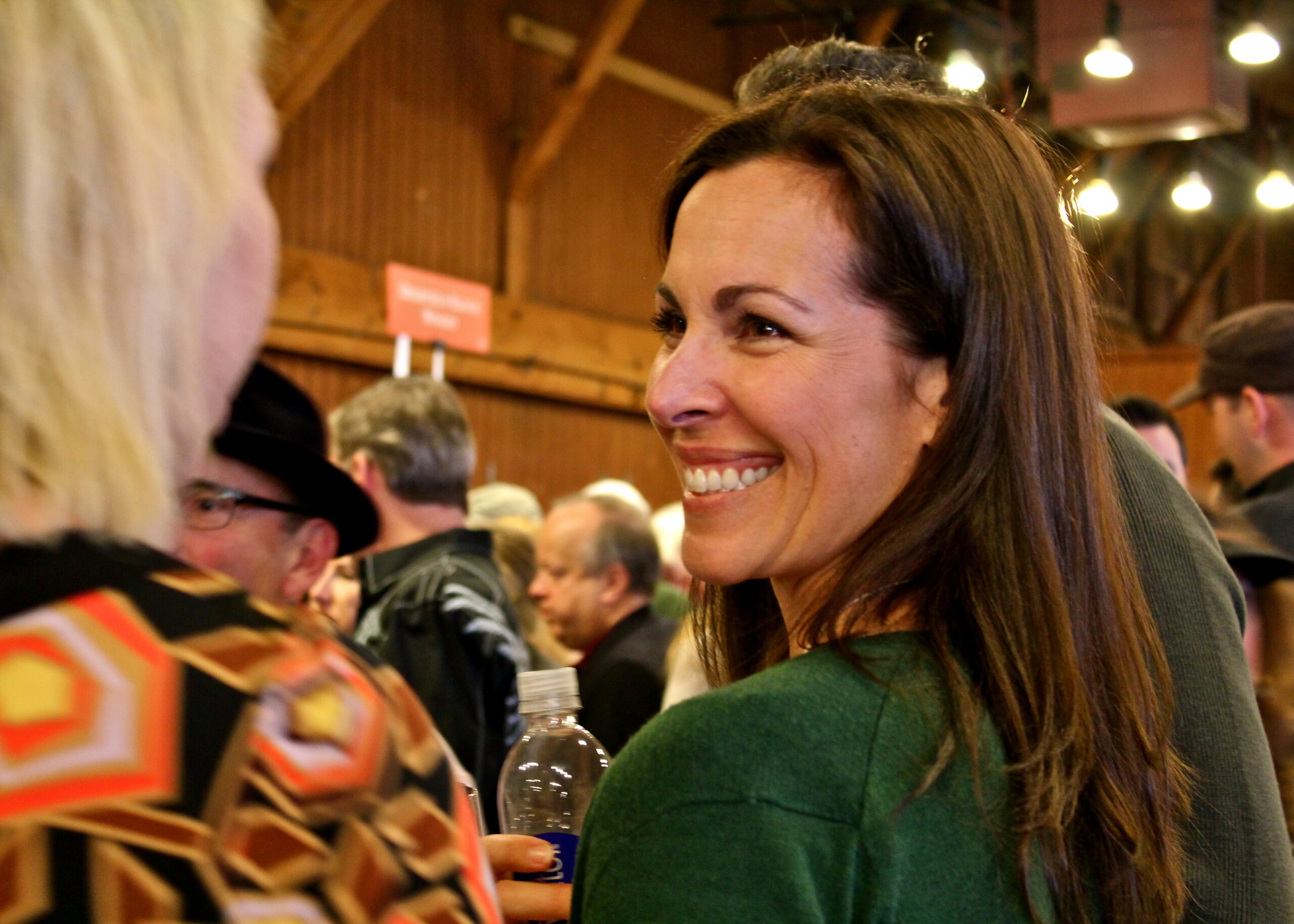 Smiling woman at a wine event representing Lodi Winegrape Commission.