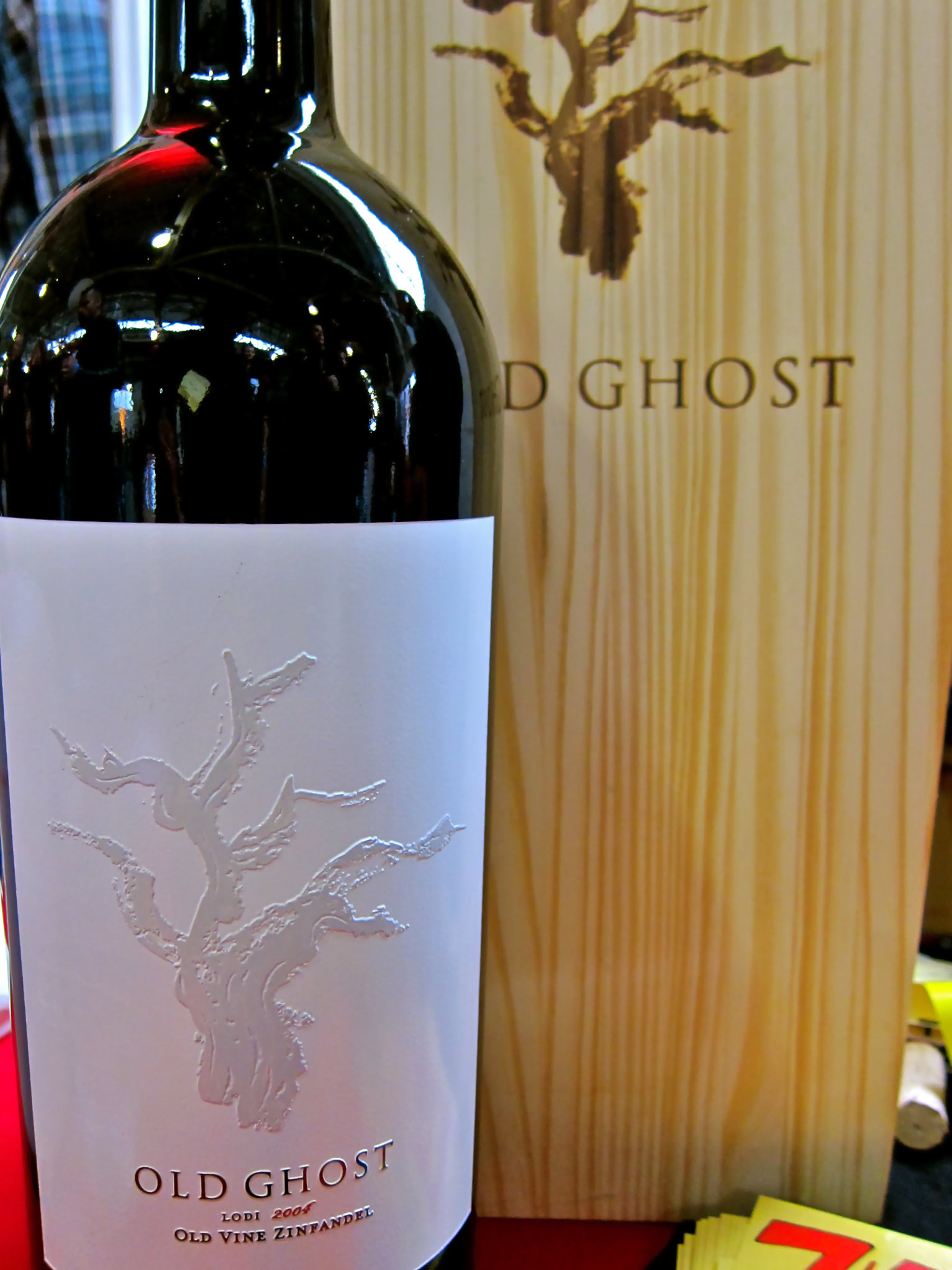 Old Ghost wine bottle with embossed tree logo and wooden box packaging for Lodi wine region.