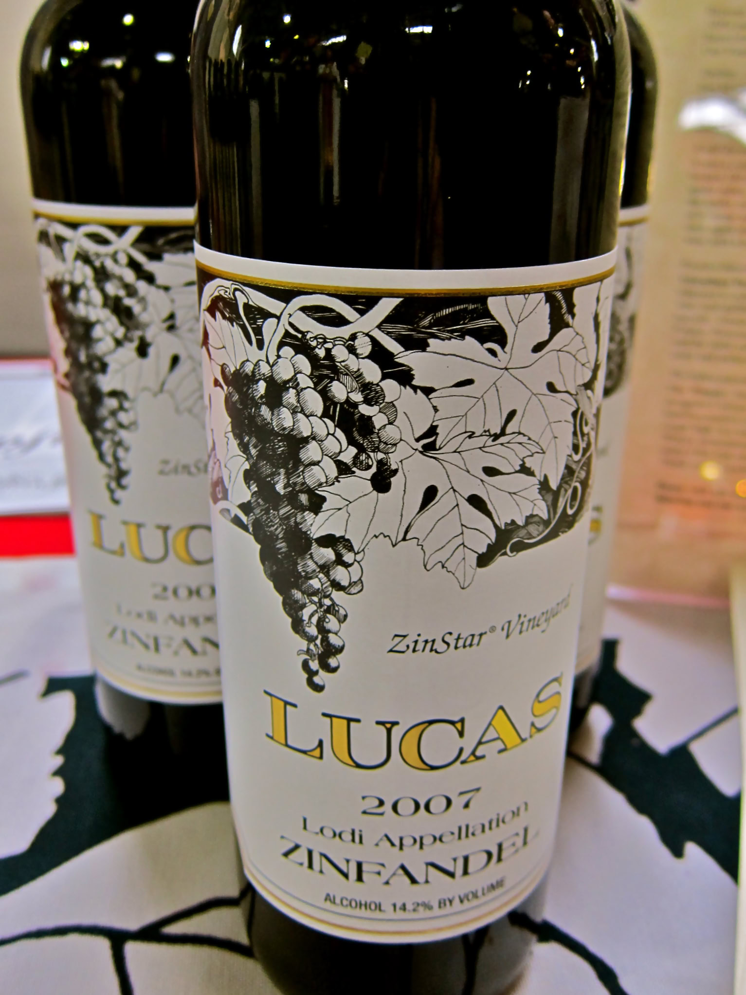 Lodi Zinfandel wine bottle from 2007 with grape and leaf design on label.