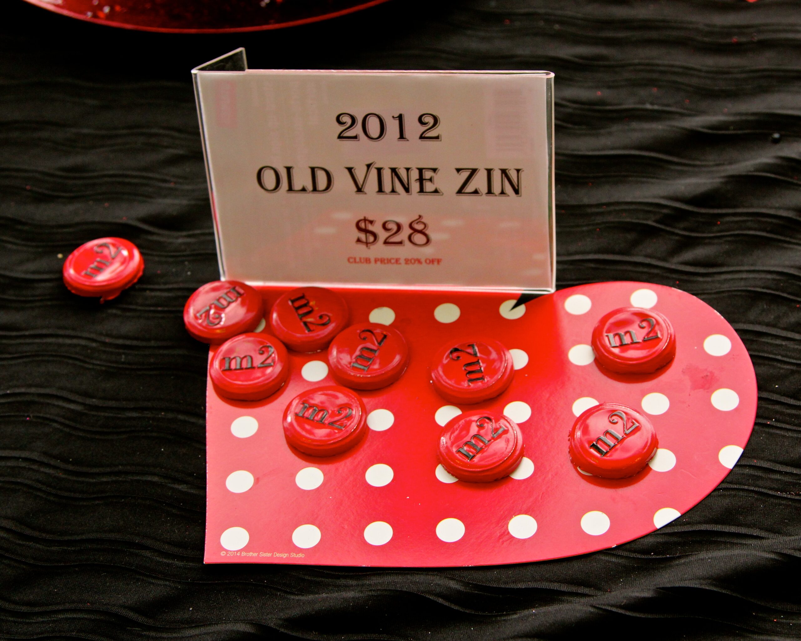 Vintage wine bottle corks and price sign from Lodi Winegrape Commission, 2012 Old Vine Zinfandel, $28.