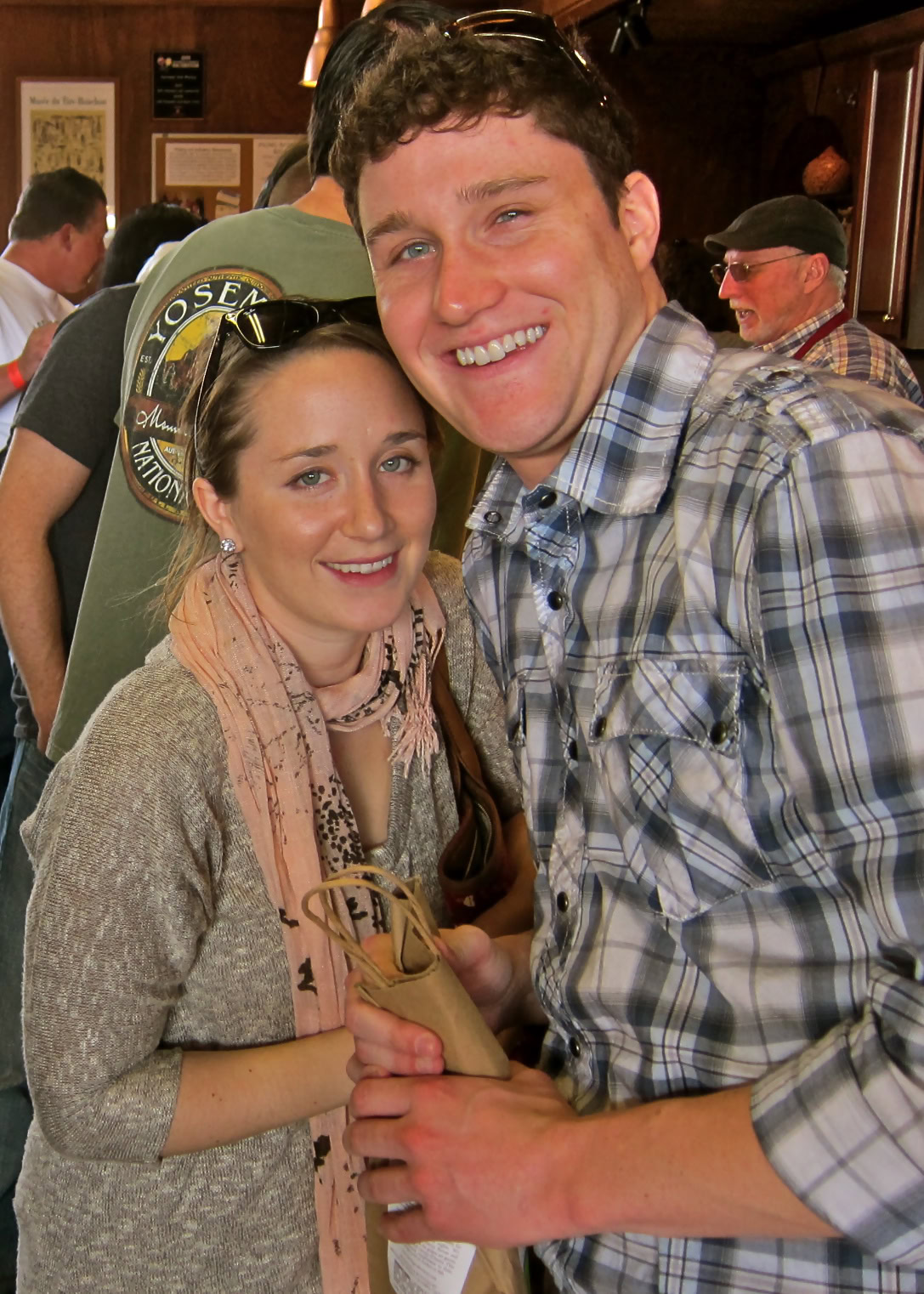 Smiling couple at a Lodi Winegrape Commission event, enjoying wine tasting and socializing.