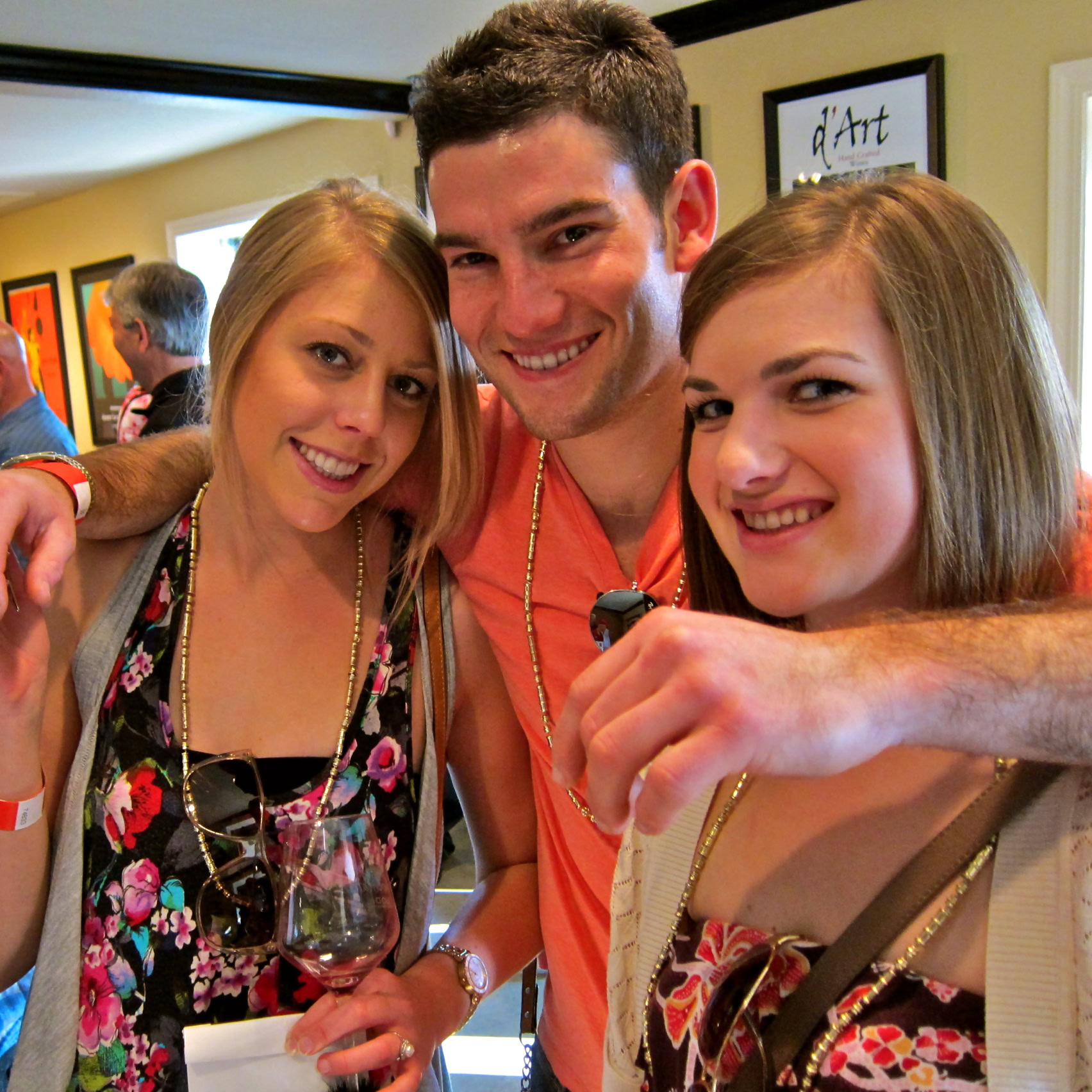 Group of friends enjoying wine at a Lodi Winegrape Commission event, smiling and celebrating together.
