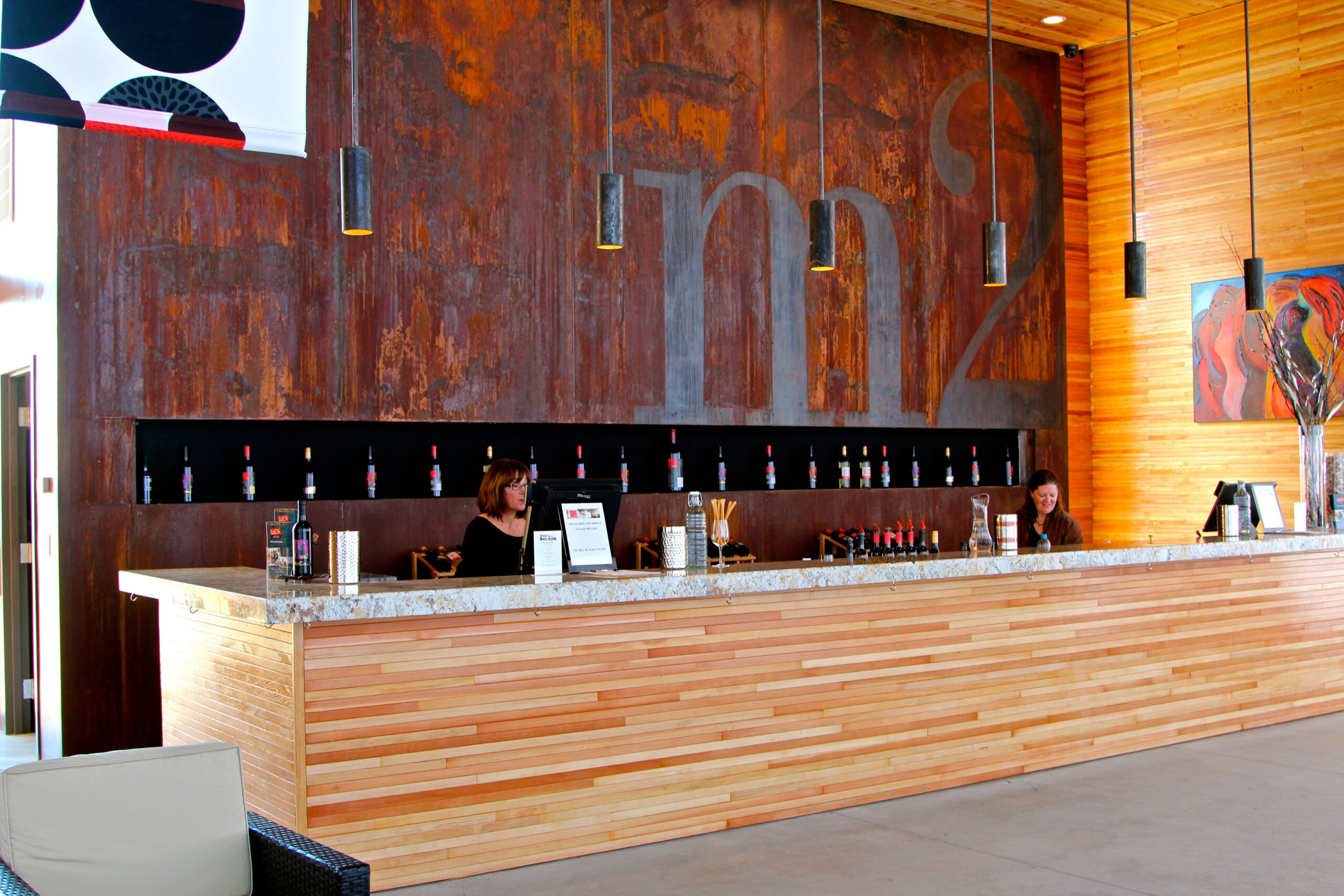Modern reception area with wooden accents and wine bottles at Lodi Winegrape Commission.