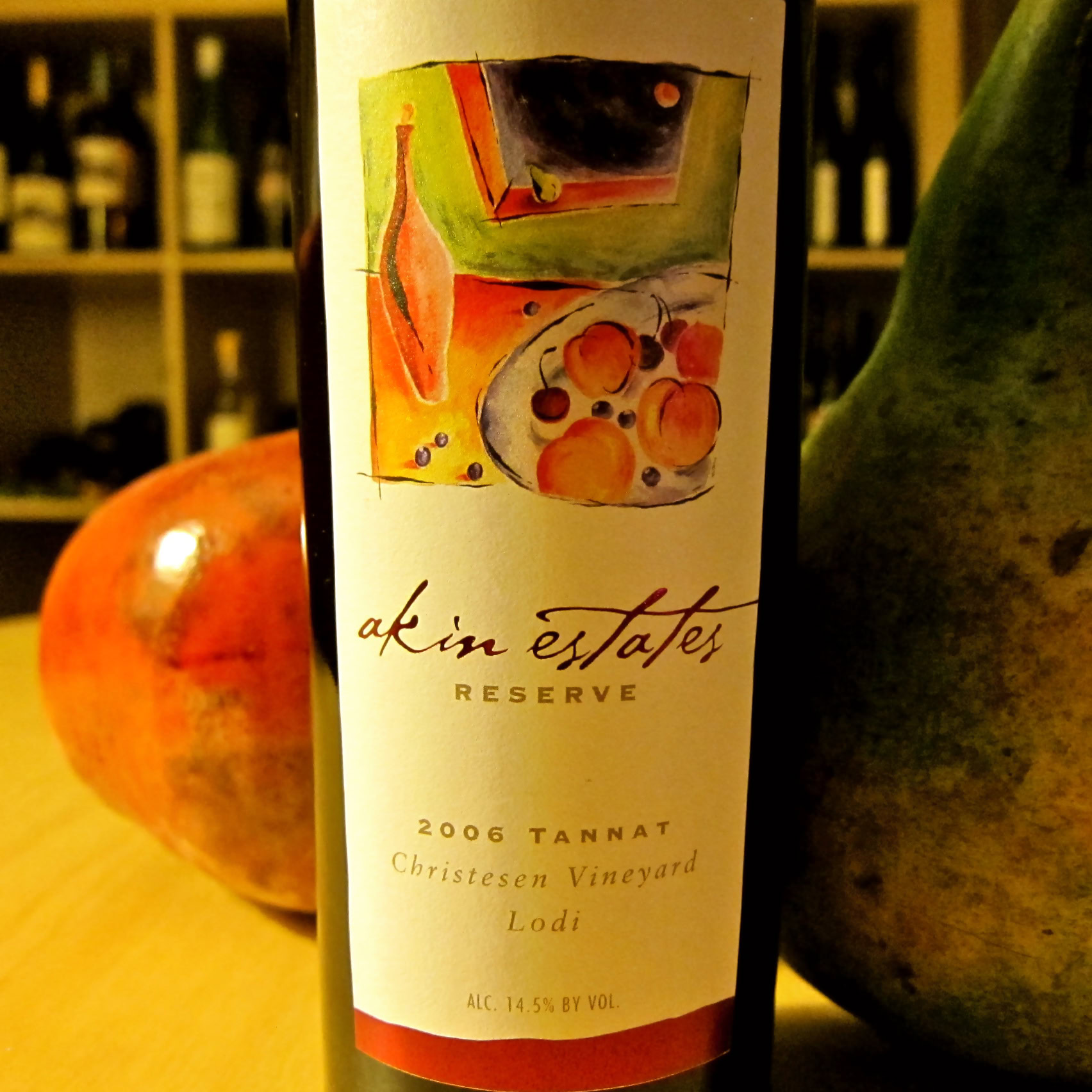Close-up of a 2006 Tannat wine bottle from Christesen Vineyard, Lodi, with colorful artwork on the label.