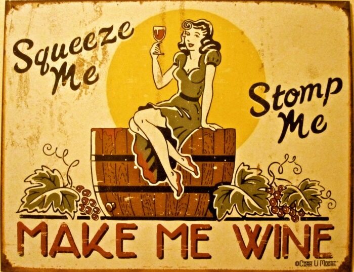 Vintage sign promoting wine with a woman sitting on a wine barrel holding a glass of wine.