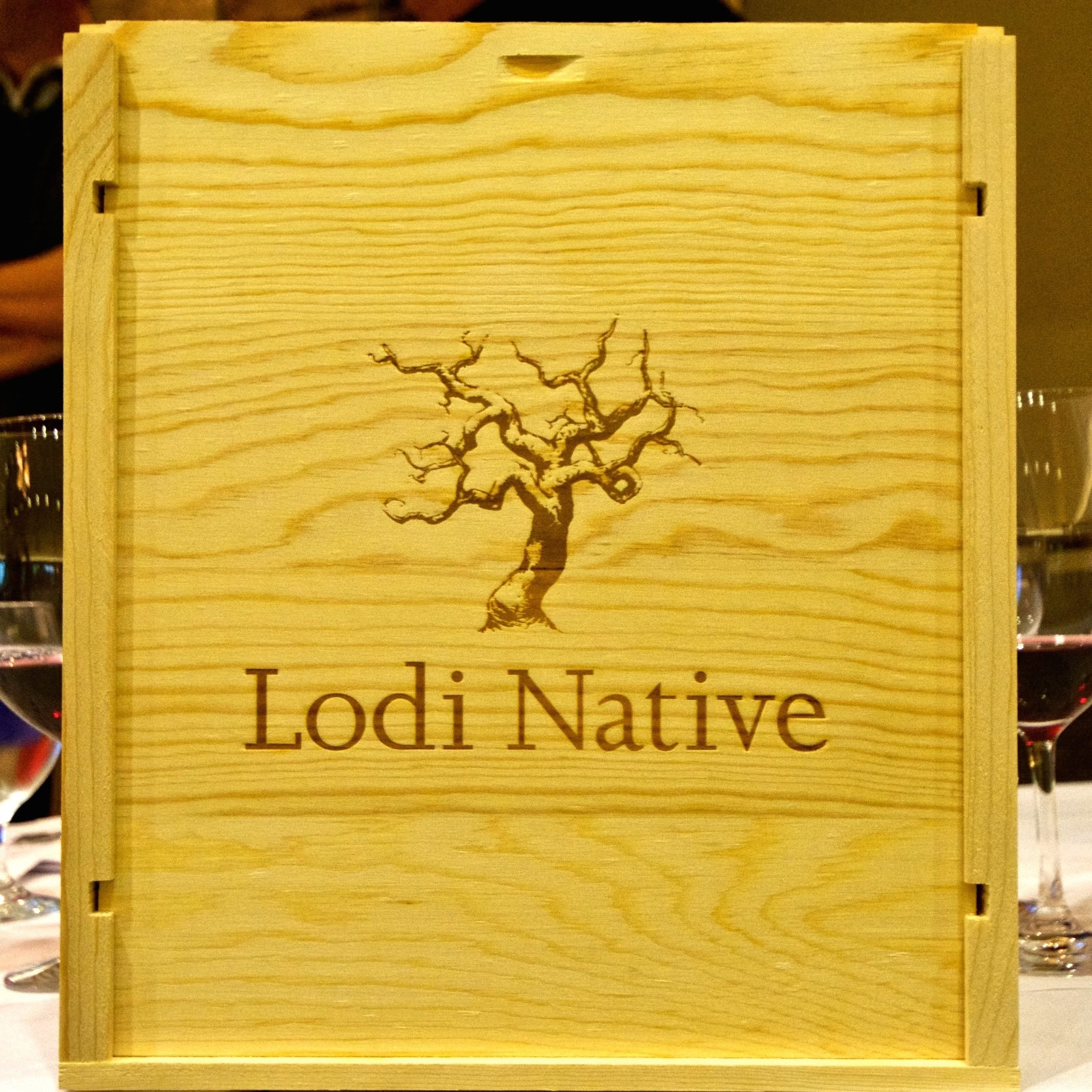 Lodi Native wooden box with a tree logo and text, representing Lodi Winegrape Commission.