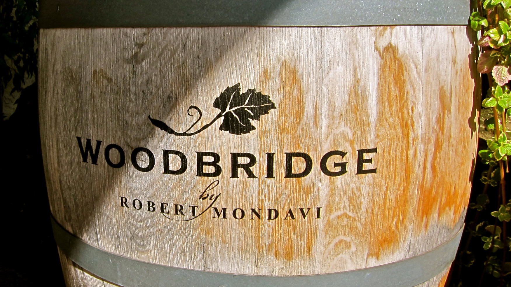 Close-up of Woodbridge by Robert Mondavi wine bottle label with wood grain design.