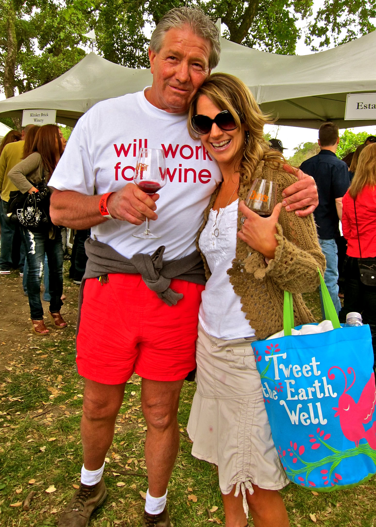Smiling man and woman enjoying wine at Lodi Winegrape Commission event.