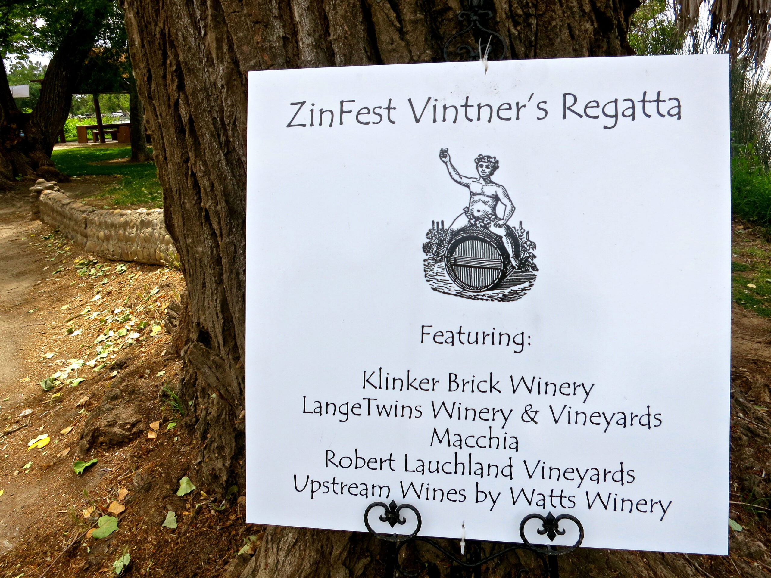 Event sign for ZinFest Vintner's Regatta featuring local wineries and vineyards in Lodi, California.