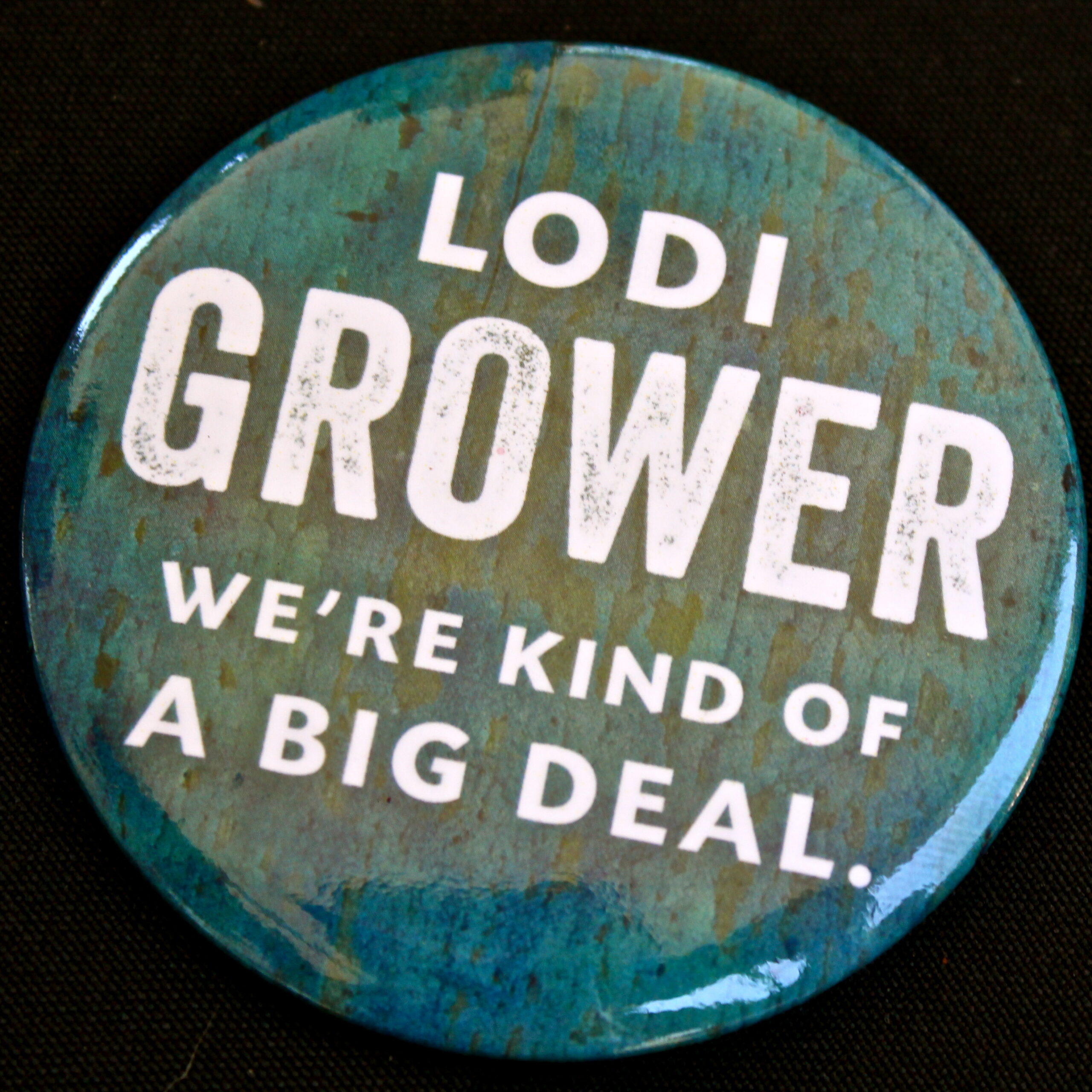 Lodi Grower badge with slogan 'We're kind of a big deal' for wine industry promotion.