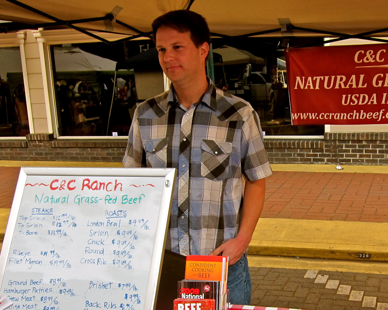 Young man at Lodi wine event promoting local winegrapes and beef products.