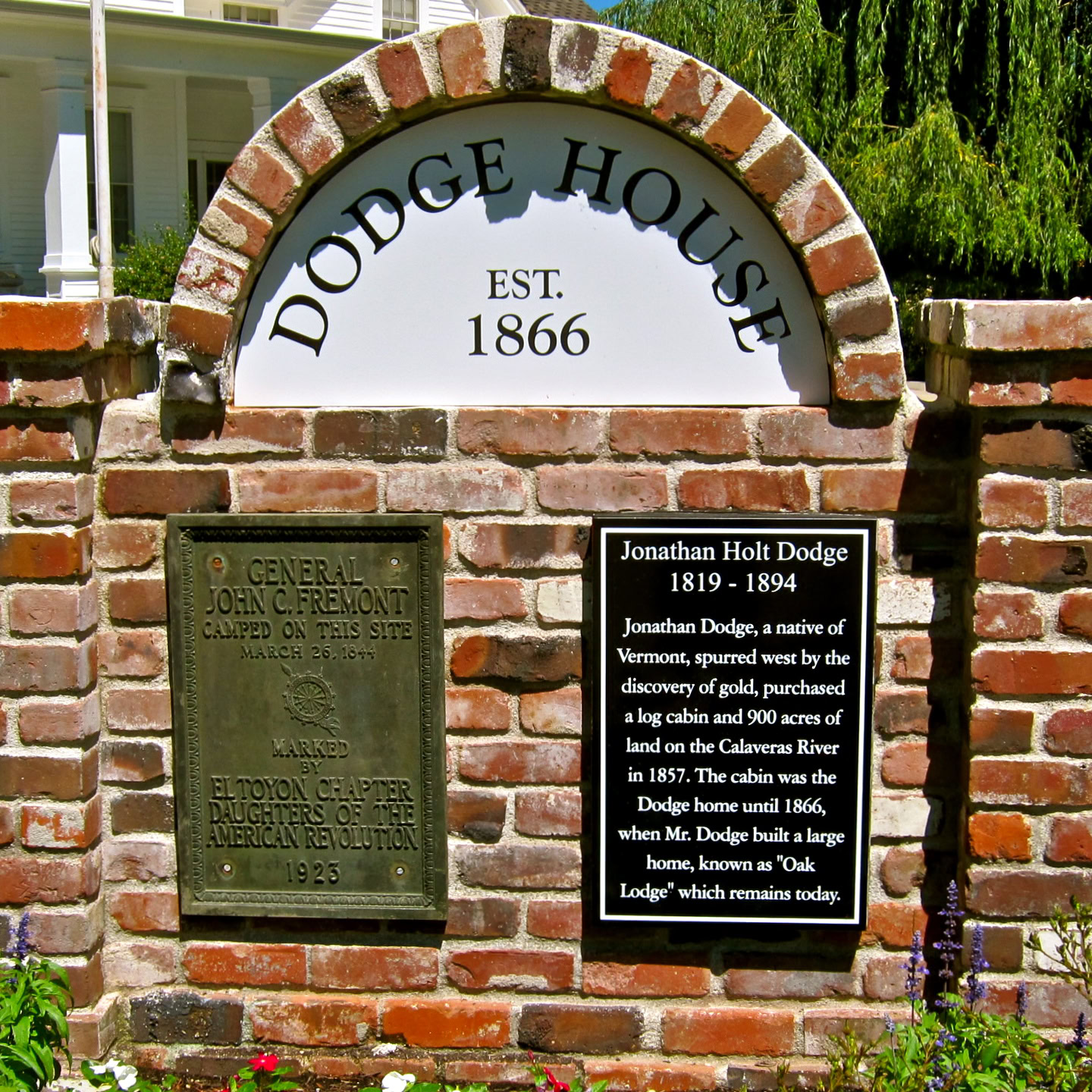 Historic Dodge House marker with brick arch and plaques in Lodi, California.