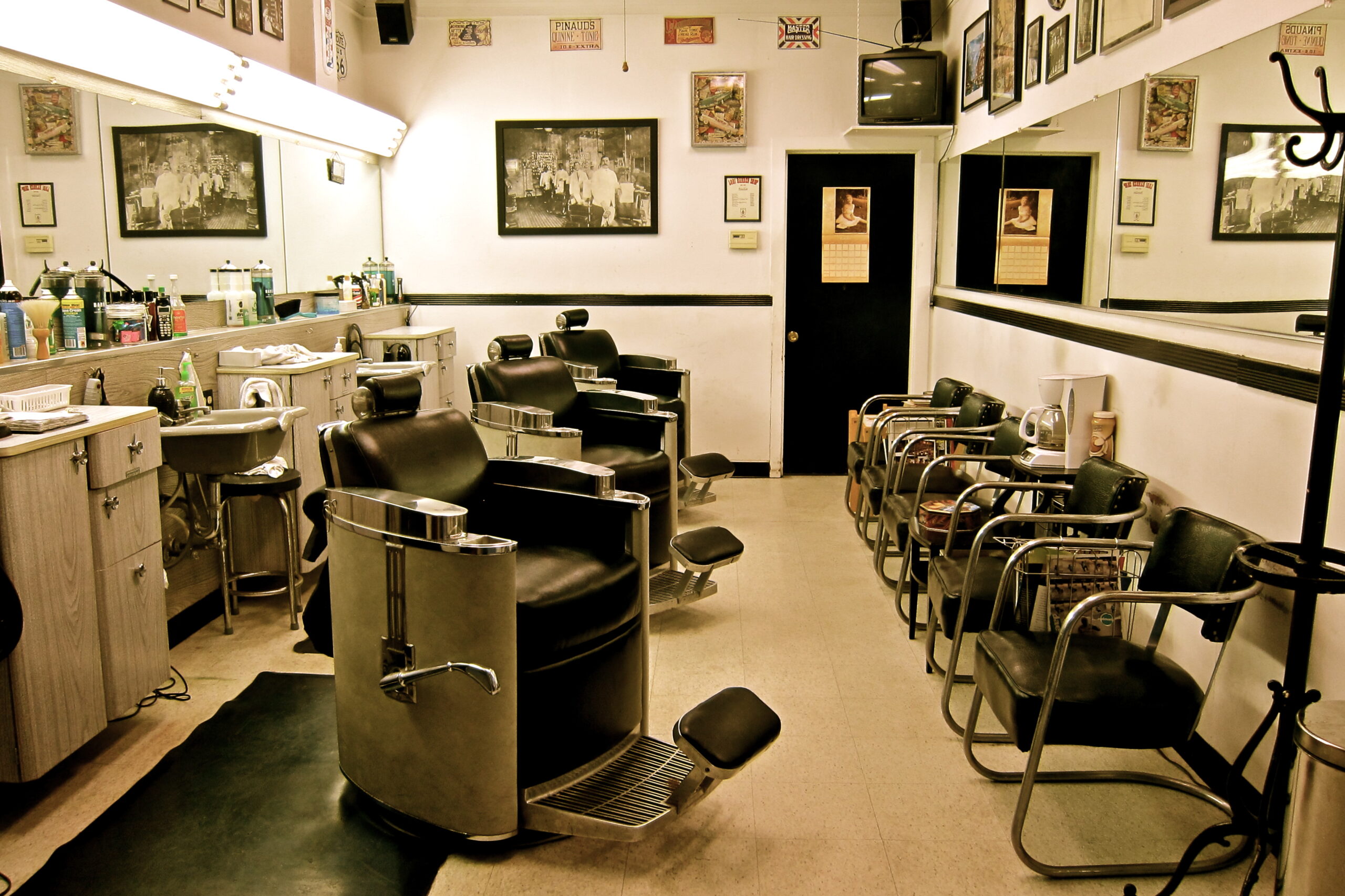 Interior of a hair salon with chairs, mirrors, and hairdressing tools, promoting Lodi Winegrape Commission.