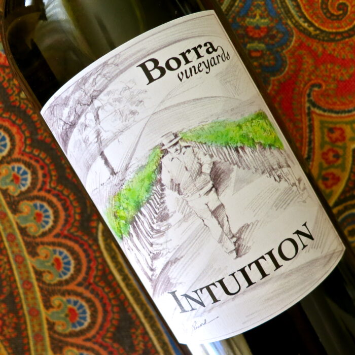 Close-up of Borra Vineyard Intuition wine bottle label with vineyard illustration.