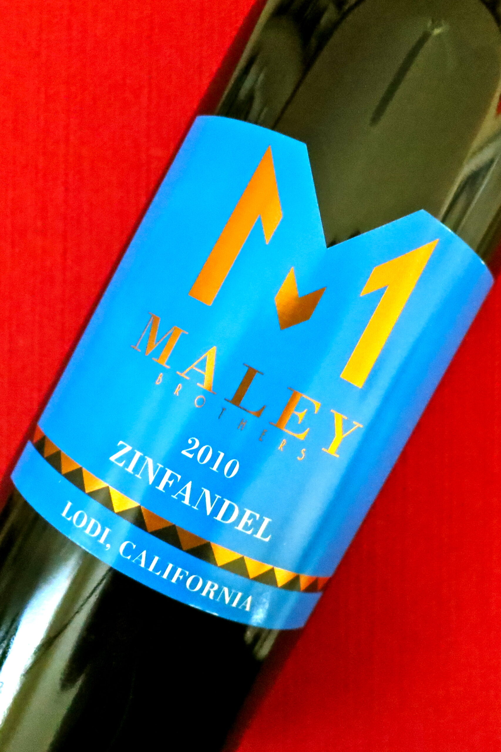 Maley Zinfandel 2010 wine bottle from Lodi California with vibrant blue label and gold accents.