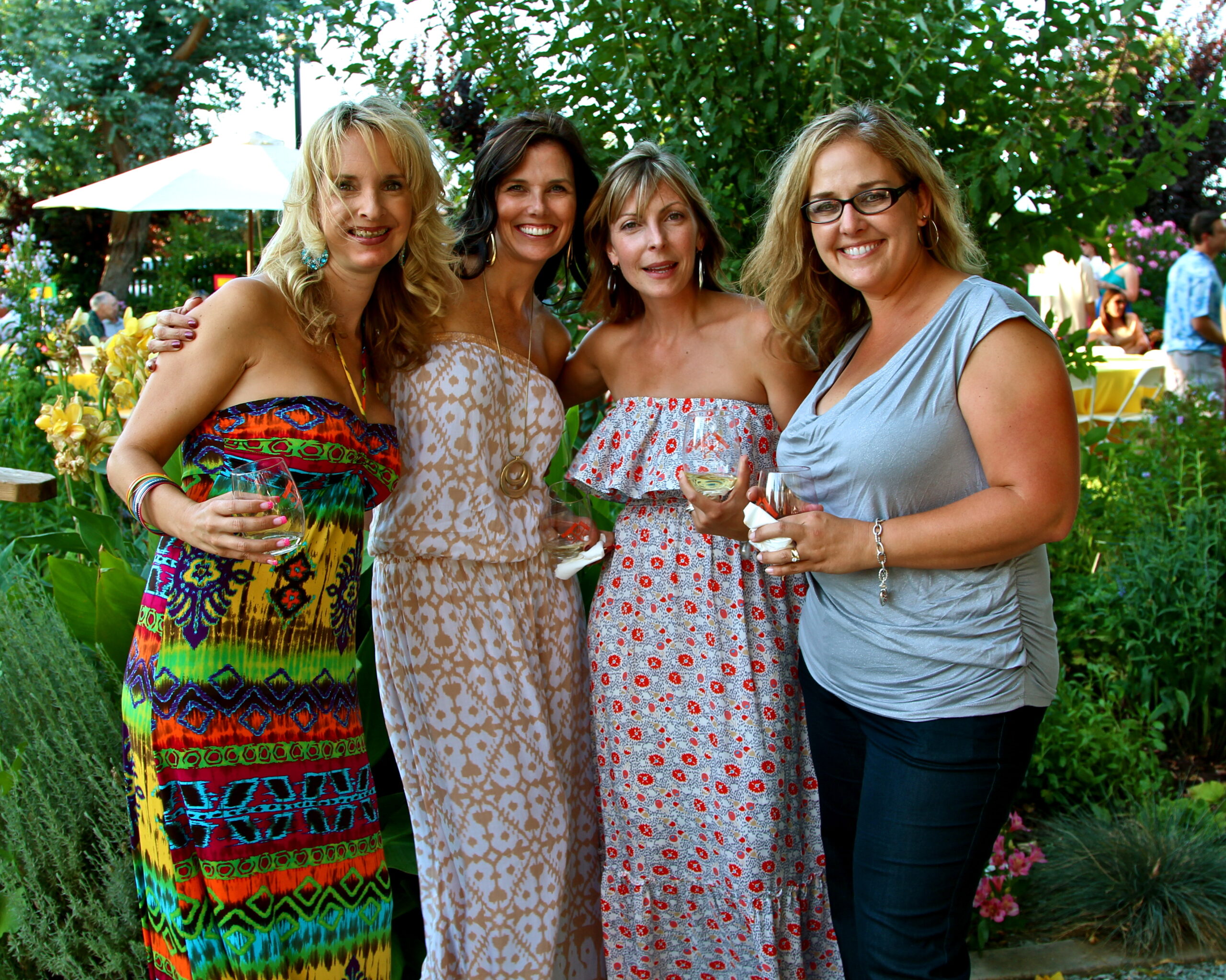 Group of women enjoying wine at a Lodi Winegrape Commission outdoor event.