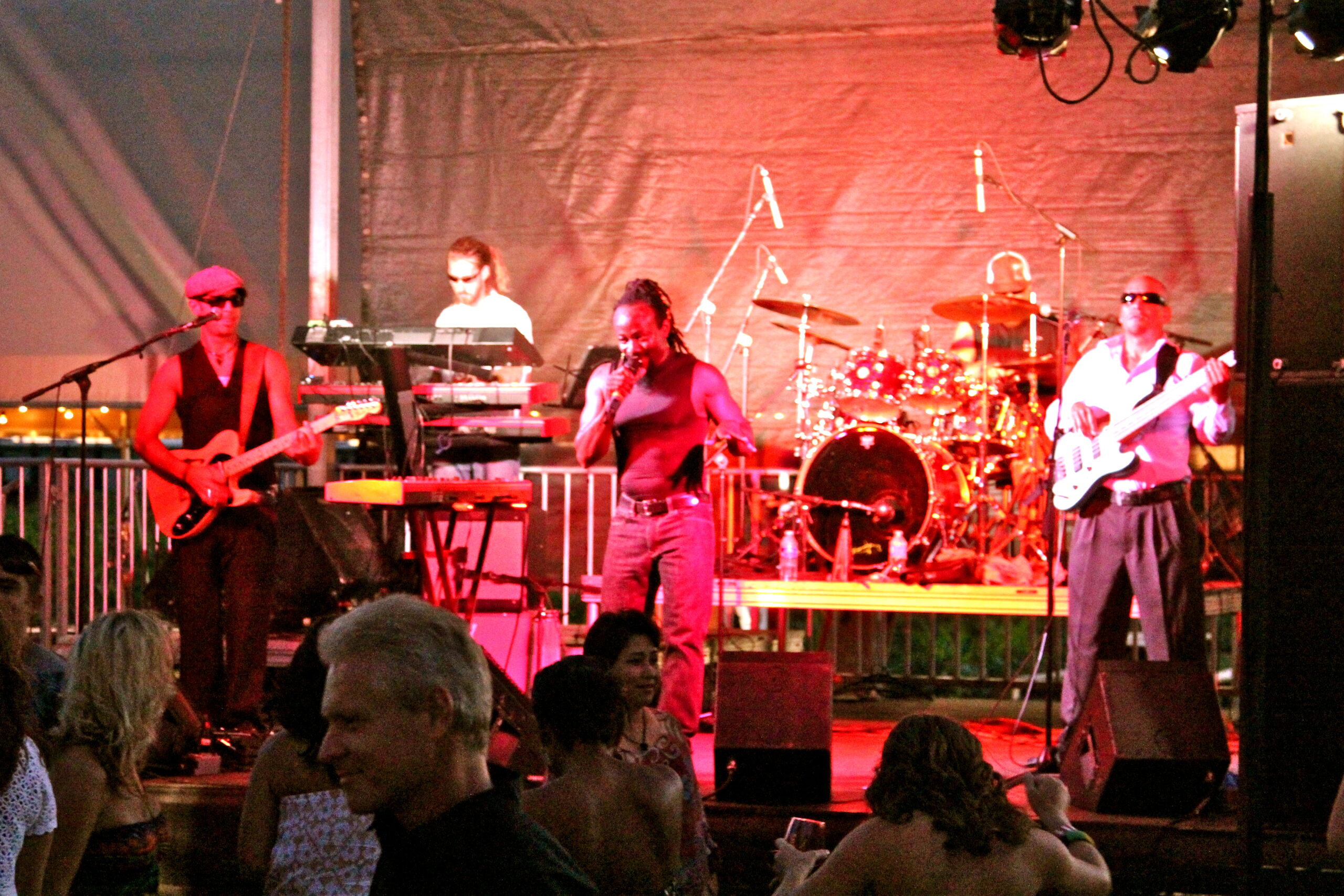 Live band performing at a Lodi Winegrape Commission event with audience enjoying the show.