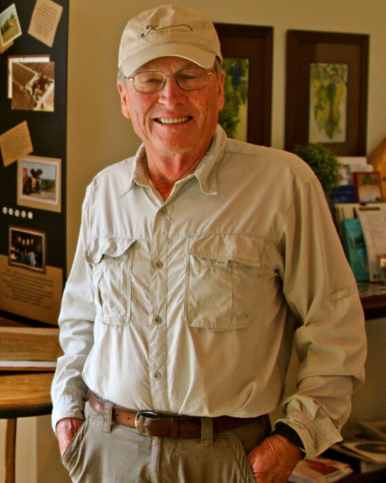 Smiling man in casual attire at Lodi Winegrape Commission event, showcasing local wine industry.