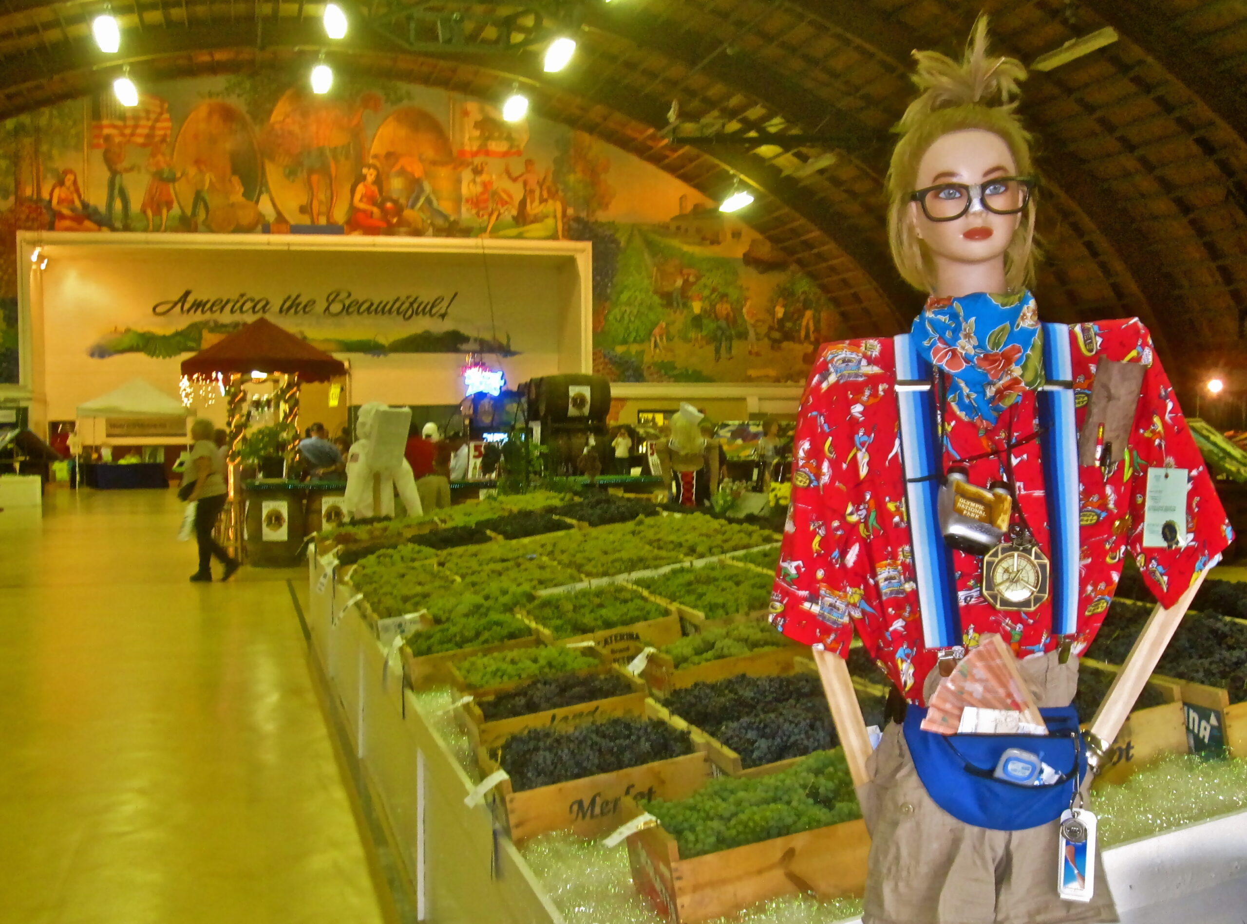 Lodi Winegrape Commission booth at market showcasing local winegrapes and produce.