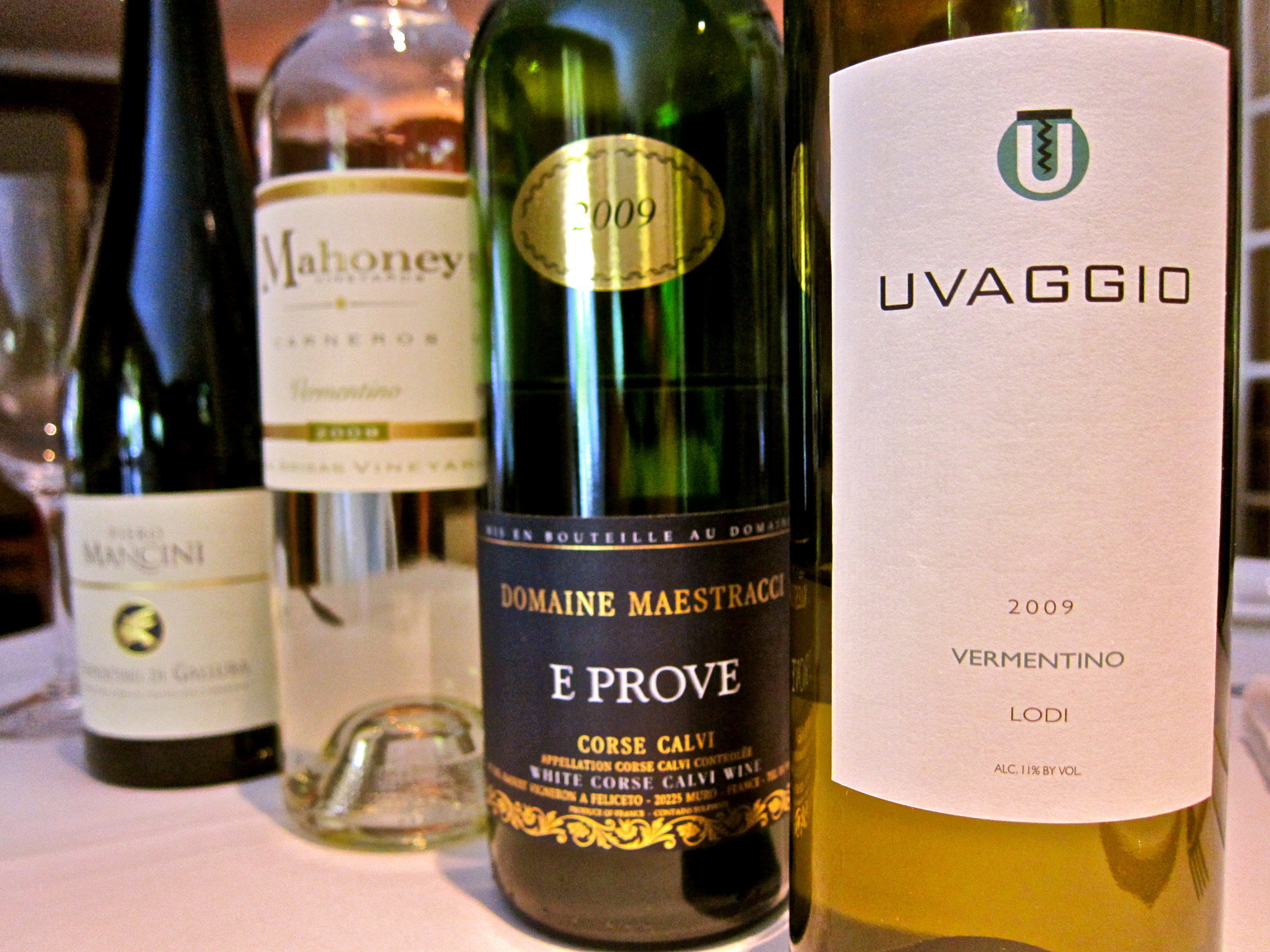 Selection of Lodi wine bottles including Uvaggio, Domaine Maestracci, and Mahoney, showcasing diverse wine varieties.