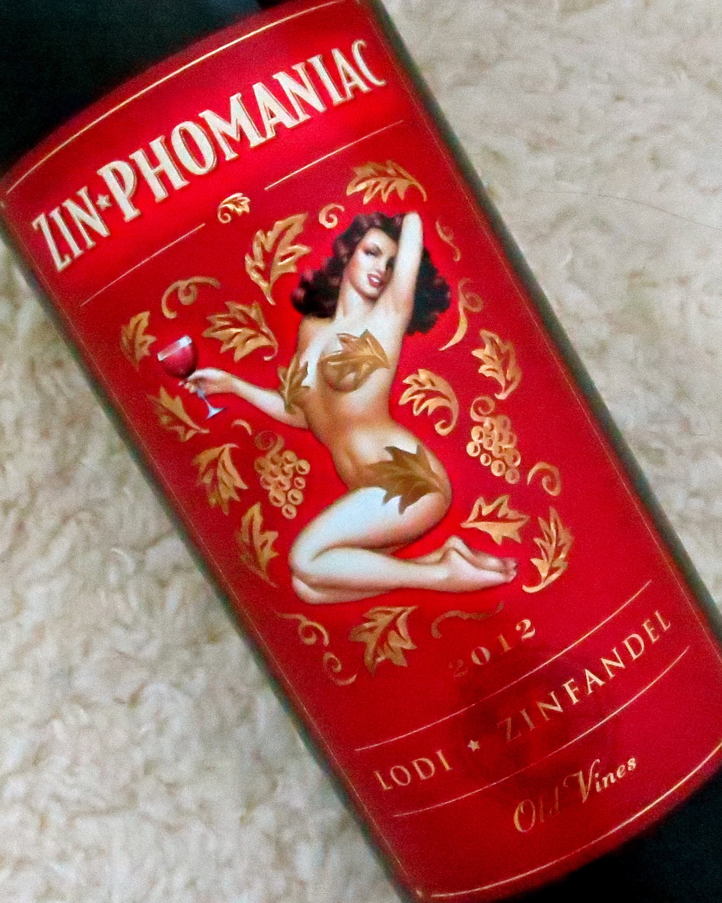 Close-up of Lodi Zinfandel wine bottle label featuring vintage artwork and grape motifs.