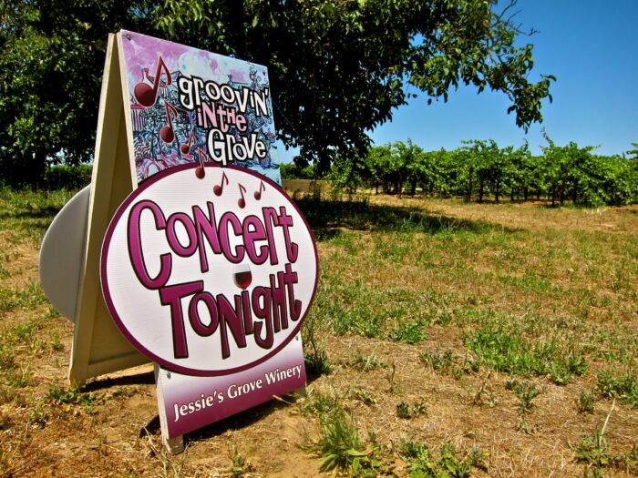 Signboard advertising a concert at Jessie's Grove Winery in Lodi, California.