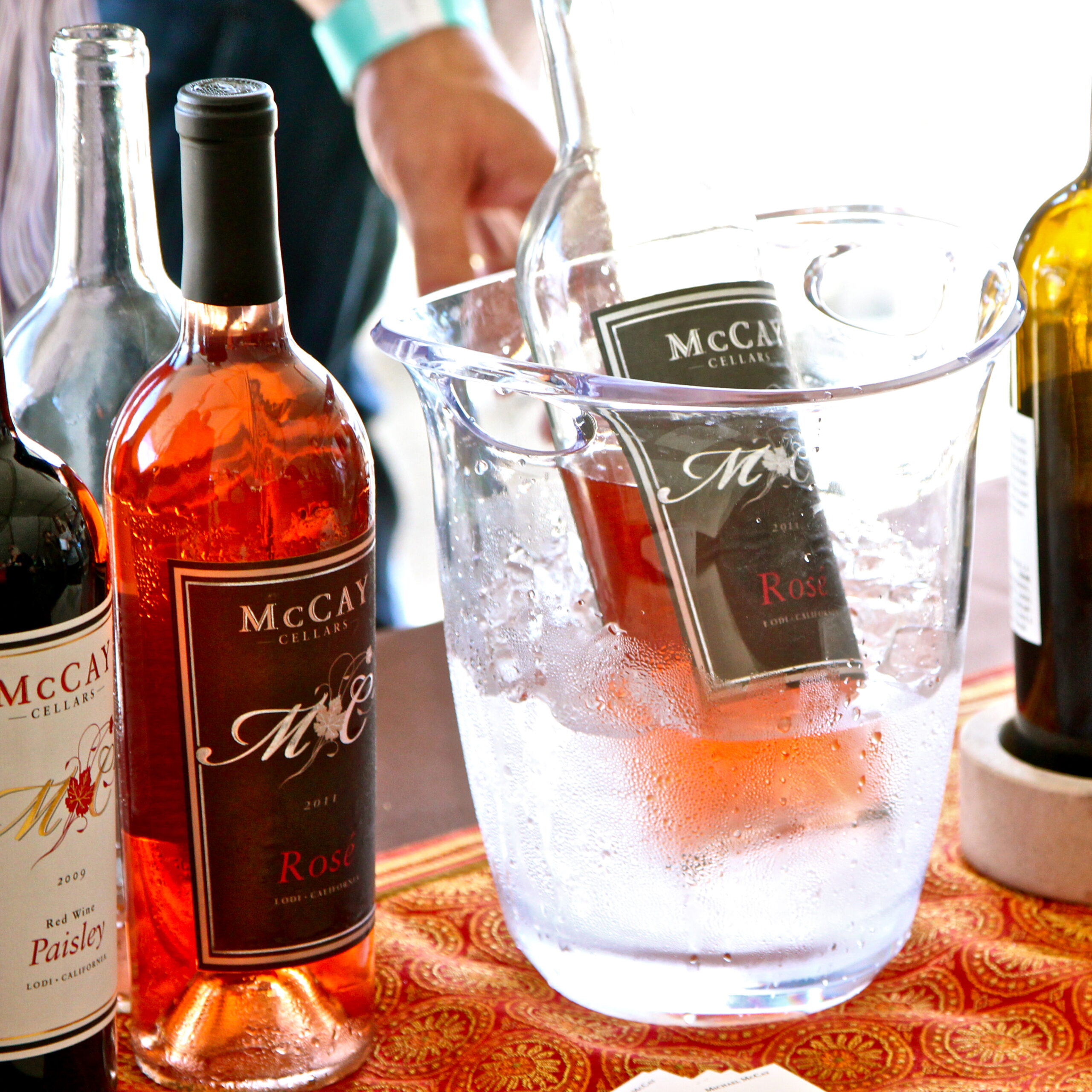 Lodi Winegrape Commission rosé wine bottles in ice bucket, showcasing local wine production.