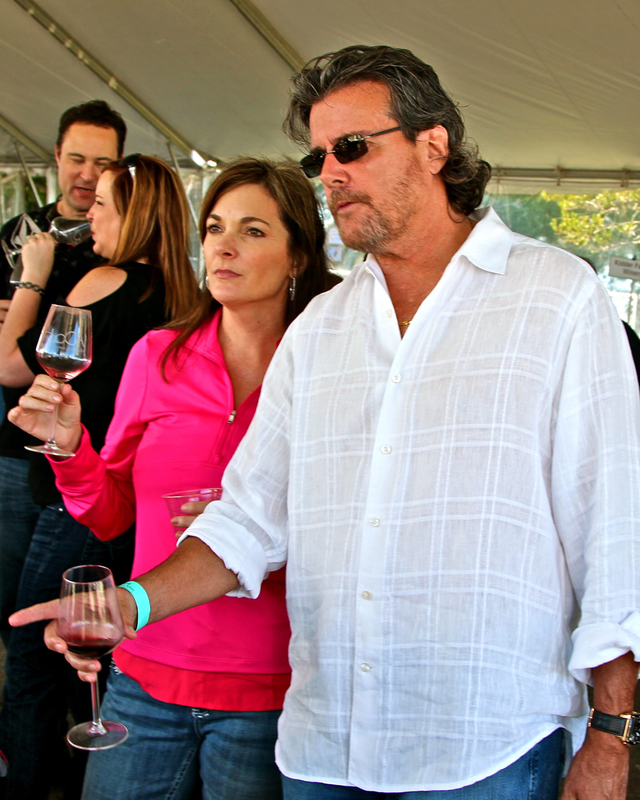 People tasting wine at a Lodi wine event, showcasing local winegrapes and wine culture.