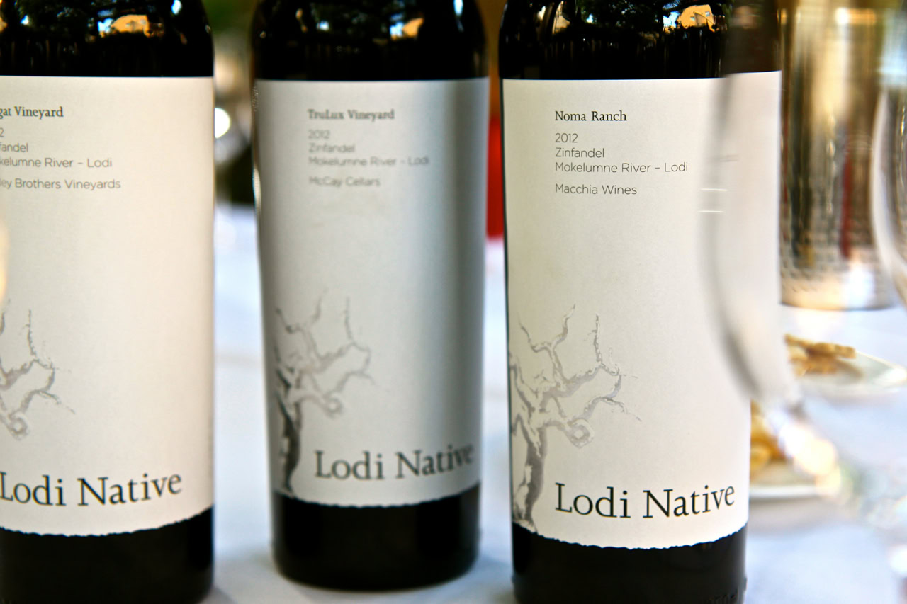 Three bottles of Lodi Native wine from Zinfandel and Macchia Wines on a table.