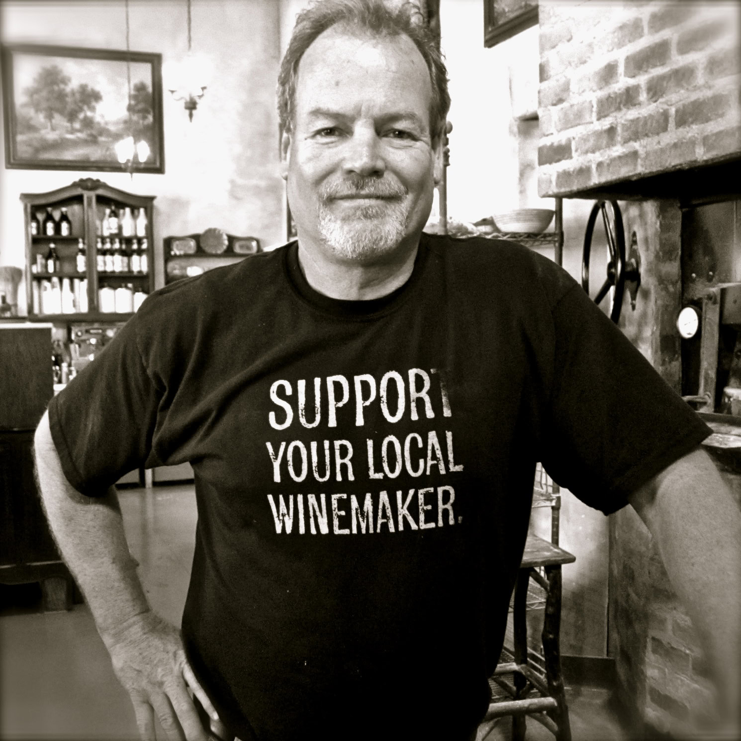 Man wearing a T-shirt supporting local winemakers at Lodi Winegrape Commission event.