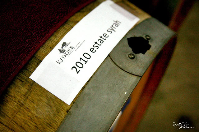 Close-up of a wine barrel with a label for 2010 estate Syrah from Lodi Winegrape Commission.