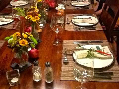 Beautifully set dining table in Lodi wine region with flowers, wine glasses, and tableware for a wine tasting event.