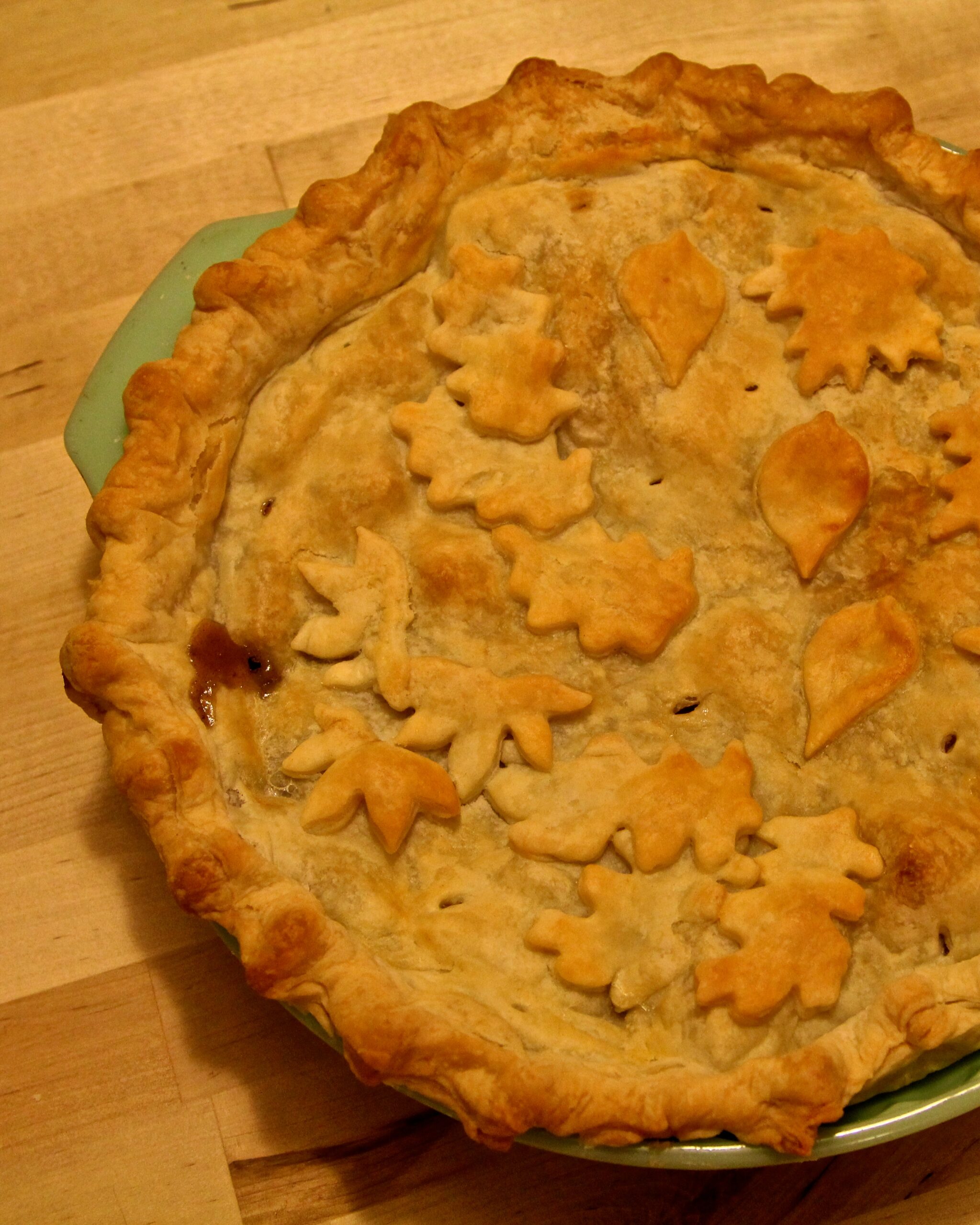 Freshly baked pie with leaf-shaped pastry decorations, representing Lodi Winegrape Commission's focus on local wine and grape.
