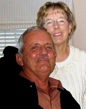 Smiling elderly man and woman at Lodi Winegrape Commission event, showcasing community and wine industry collaboration.