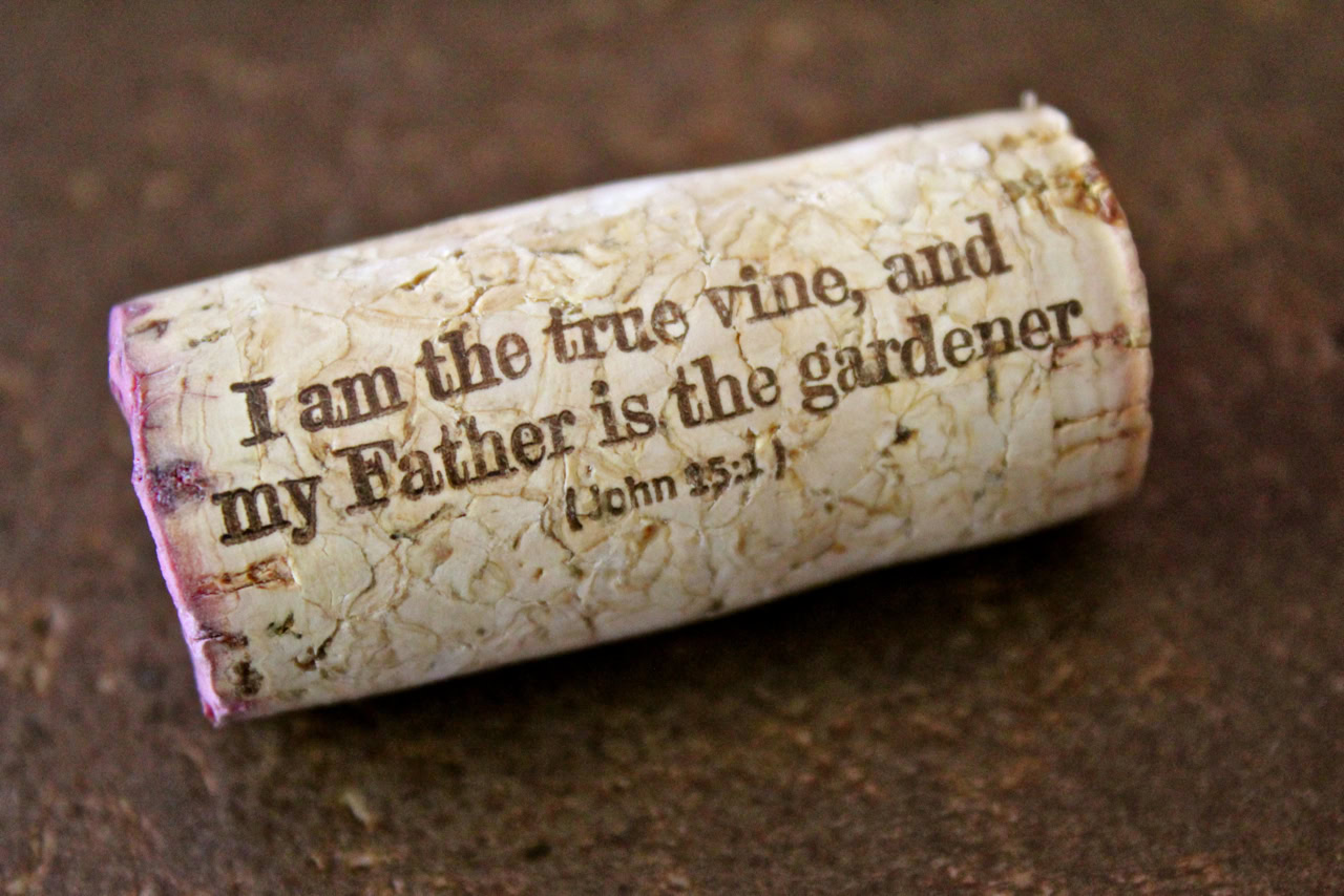 Wine cork with quote from John 15:1 about true vine and Father as gardener.