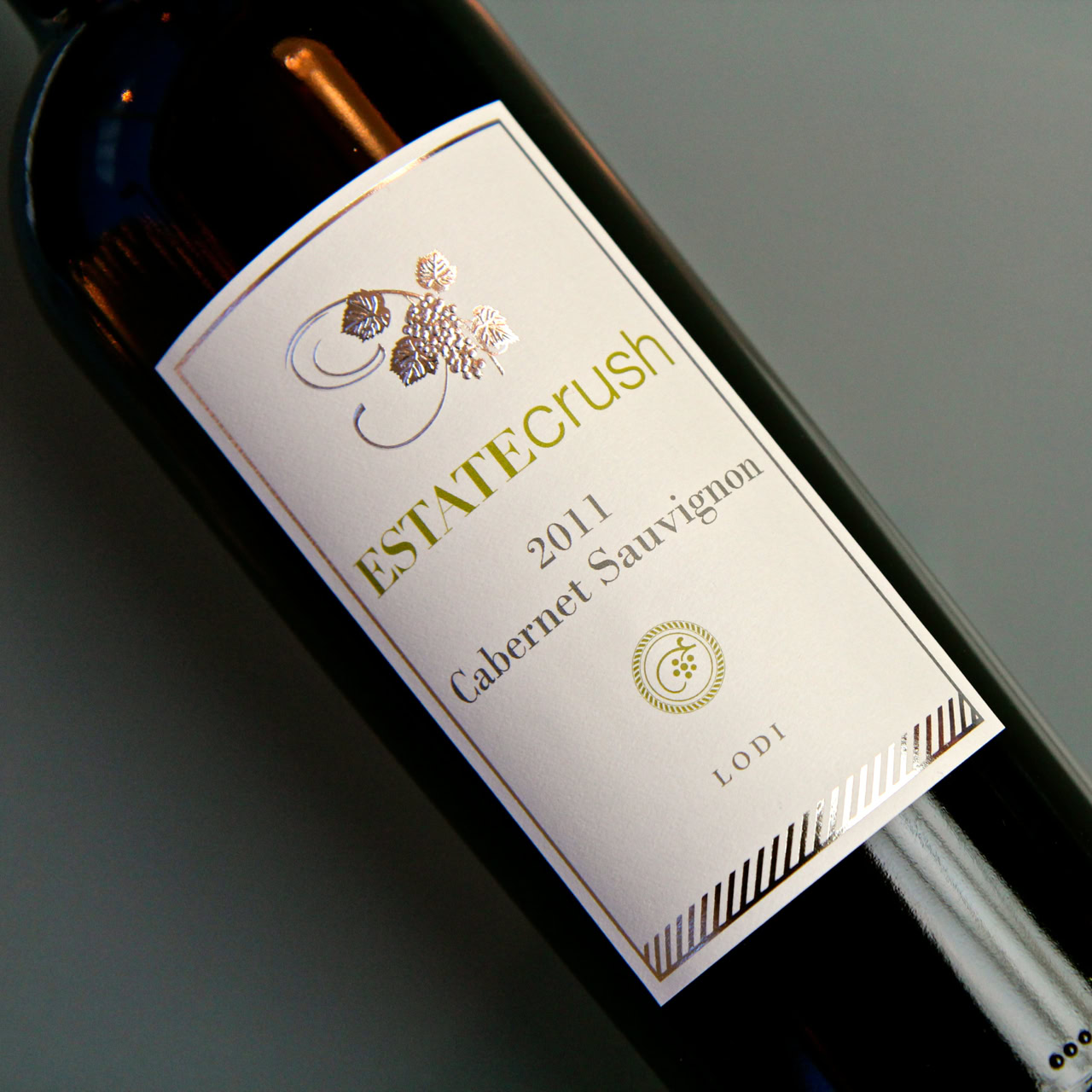 Close-up of Lodi Statecrush Cabernet Sauvignon 2011 wine bottle label with grapes illustration.