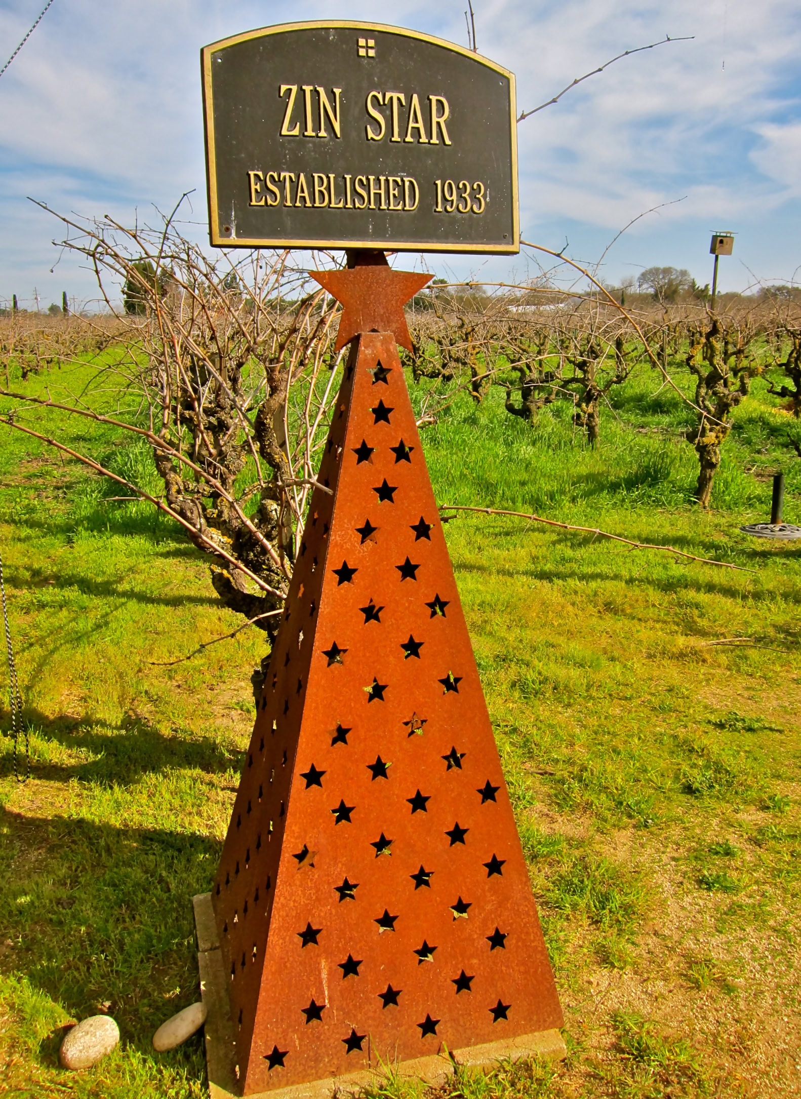 Zin Star vineyard sign established in 1933 with star-shaped cutouts on a rust-colored metal cone in Lodi wine region.