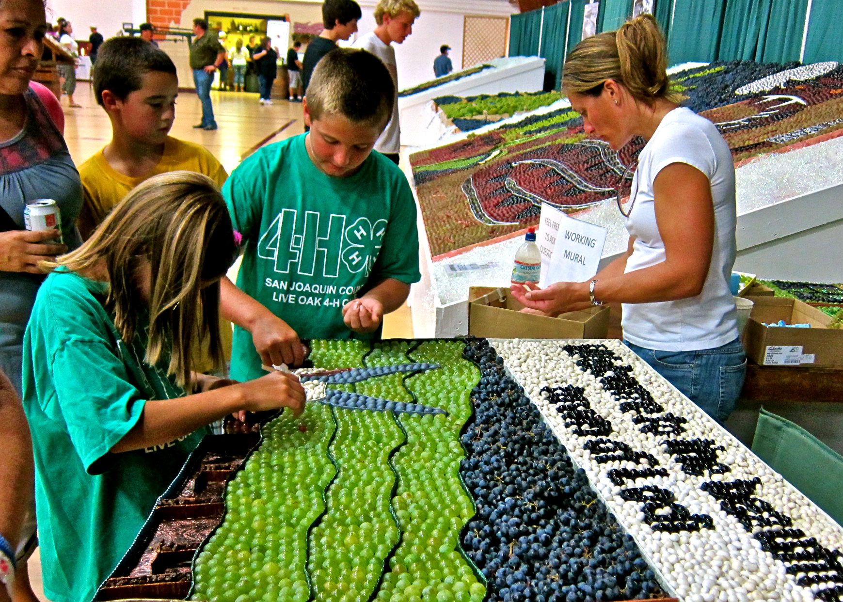 Children and adults enjoy grape-themed activities at a Lodi Winegrape Commission event.