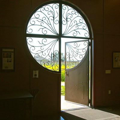 Ornate circular window with wrought iron design at Lodi Winegrape Commission.