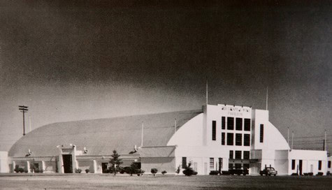 Historic black and white photo of the Lodi Winegrape Commission building with a curved roof and modern architecture.